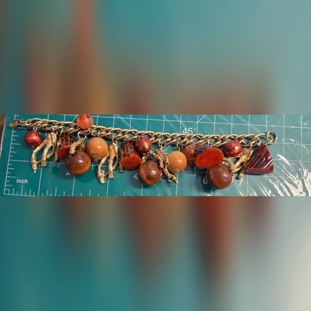 Bakelite gold tone charm bracelet